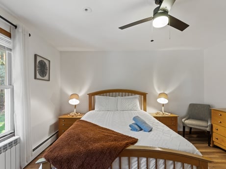 An image featuring furniture, window, comfort, ceiling fan, wood, lighting, building, interior design, floor, flooring at 125 Rimstone Ct.