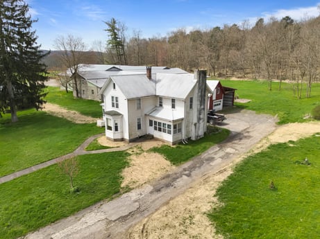 An image featuring plant, sky, building, cloud, tree, house, land lot, window, cottage, grass at 525 Spring Hill Rd.