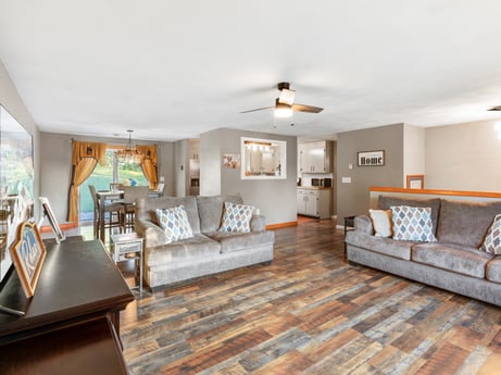 An image featuring furniture, couch, picture frame, table, wood, interior design, grey, building, floor, living room at 491 Hillcrest Dr.