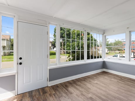 An image featuring window, building, fixture, wood, interior design, hall, floor, flooring, shade, wall at 203 Harrison St.