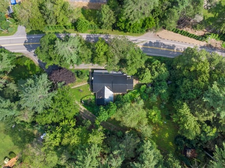 An image featuring property, plant, plant community, tree, land lot, natural landscape, urban design, residential area, neighbourhood, shrub at 9224 PA-87.