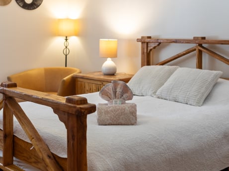 An image featuring brown, furniture, comfort, wood, interior design, lighting, lamp, floor, flooring, pillow at 125 Rimstone Ct.