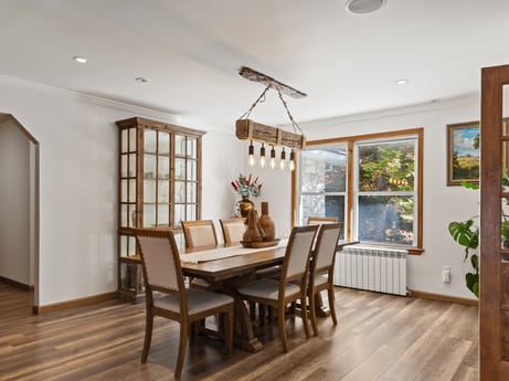 An image featuring furniture, plant, chair, window, wood, houseplant, lighting, table, flooring, interior design at 125 Rimstone Ct.