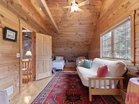 An image featuring furniture, property, window, picture frame, couch, wood, interior design, floor, flooring, living room at 1761 Brick House Rd.