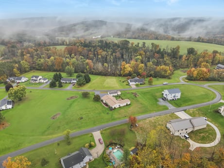 An image featuring cloud, sky, plant, property, tree, mountain, natural landscape, land lot, grass, biome at Country View Dr.