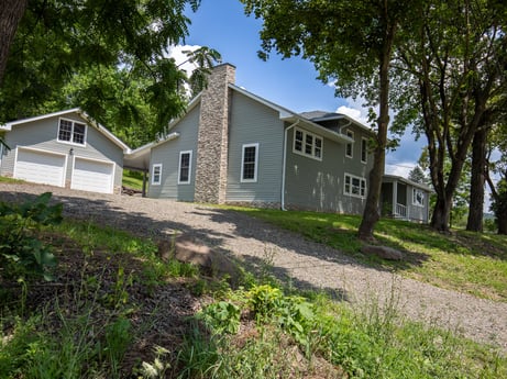 An image featuring plant, building, sky, window, tree, house, land lot, cottage, residential area, door at 17899 US-6.