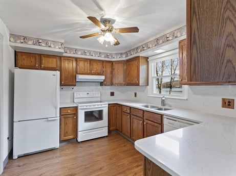 A kitchen at 199 S Lake Rd featuring: countertop, cabinetry, property, furniture, sink, building, kitchen, kitchen appliance, wood, ceiling fan