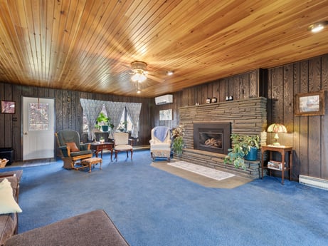An image featuring furniture, interior design, living room, floor, wood, flooring, houseplant, leisure, couch, real estate at 1195 Twin Cuts Rd.