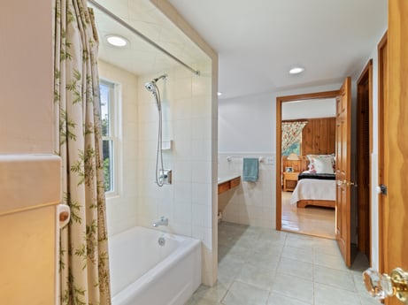 An image featuring bathtub, plumbing fixture, tap, mirror, building, bathroom, fixture, house, interior design, floor at 130 Haighs Pond Rd.