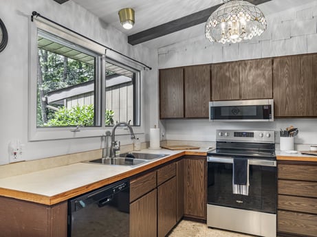 A kitchen at 104 Stony Mountain Rd featuring: kitchen sink, cabinetry, countertop, sink, tap, property, plant, kitchen, plumbing fixture, window