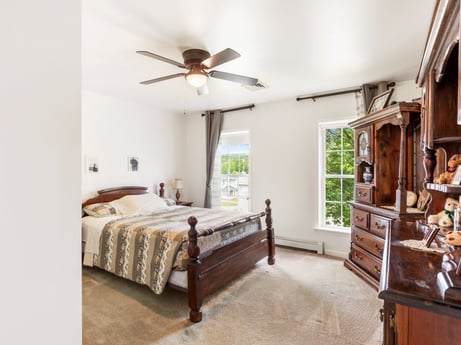 An image featuring property, furniture, ceiling fan, building, window, cabinetry, wood, drawer, lighting, comfort at 105 Thomas St.