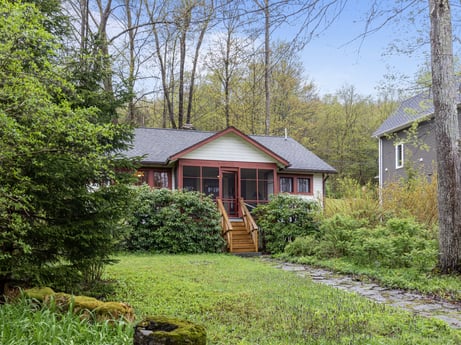 An image featuring plant, sky, window, building, natural landscape, tree, house, land lot, wood, grass at 103 Mokoma Ave.