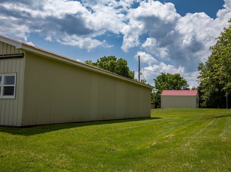 An image featuring cloud, sky, plant, window, building, tree, grass, land lot, wood, grassland at 17899 US-6.