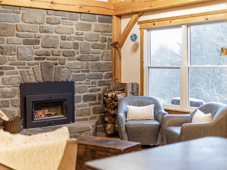An image featuring furniture, table, wood, interior design, window, living room, floor, hearth, wall, hardwood at 144 Milton Ln.