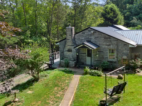 An image featuring plant, building, property, window, house, tree, natural landscape, land lot, neighbourhood, cottage at 9224 PA-87.