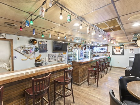An image featuring table, furniture, chair, interior design, wood, floor, flooring, ceiling, leisure, hardwood at 199 State St.