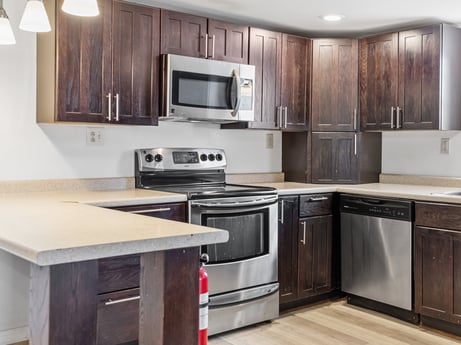 A kitchen at 5442 Clarkstown Rd featuring: cabinetry, countertop, property, furniture, kitchen appliance, white, kitchen stove, home appliance, kitchen, building