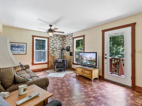 An image featuring picture frame, furniture, property, couch, table, interior design, wood, houseplant, living room, floor at 145 Nichols Ln.