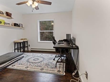 An image featuring table, ceiling fan, building, window blind, wood, window, home appliance, picture frame, comfort, interior design at 1841 Lynch Rd.