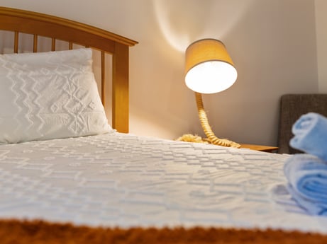 An image featuring furniture, property, comfort, wood, textile, interior design, bed frame, bed, floor, house at 125 Rimstone Ct.