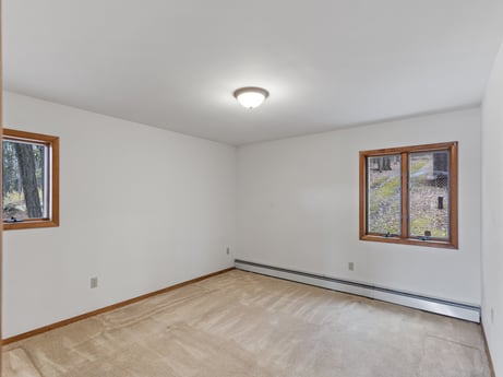 An image featuring property, picture frame, fixture, wood, paint, flooring, hall, floor, building, window at 815 Lakeside Dr.