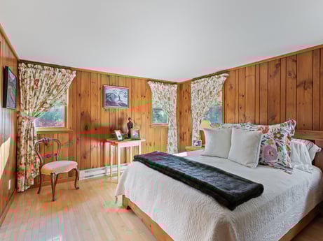 An image featuring furniture, building, comfort, azure, wood, textile, interior design, floor, bed frame, bed at 130 Haighs Pond Rd.