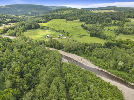 An image featuring sky, plant community, plant, ecoregion, natural landscape, natural environment, land lot, highland, grass, tree at 709 Creek Rd.