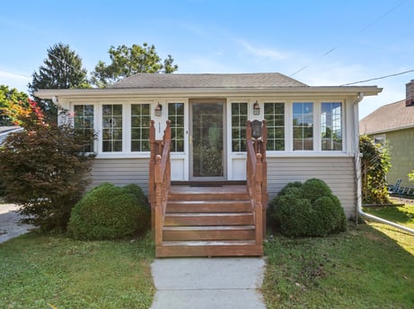 An image featuring plant, building, sky, window, door, house, land lot, tree, fixture, grass at 132 Wilbur St.