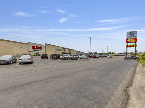 An image featuring cloud, car, sky, automotive parking light, land vehicle, wheel, tire, vehicle, motor vehicle, asphalt at 1040 Center St.