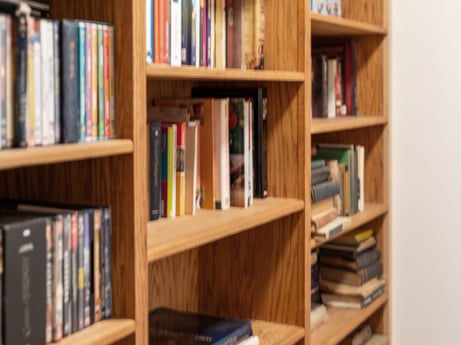 An image featuring bookcase, shelf, furniture, book, shelving, publication, wood, hardwood, room, collection at 125 Rimstone Ct.