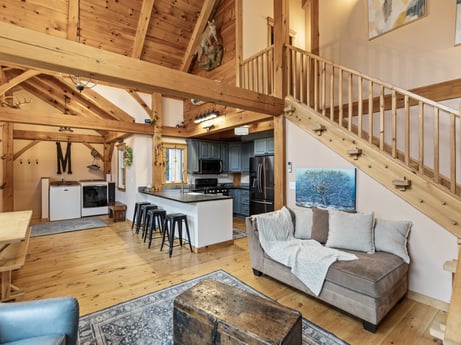 An image featuring furniture, couch, wood, interior design, architecture, building, living room, floor, table, flooring at 144 Milton Ln.