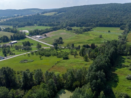 An image featuring plant, ecoregion, sky, natural landscape, natural environment, tree, highland, land lot, vegetation, grassland at 17899 US-6.