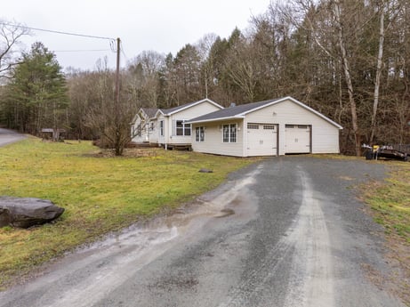 An image featuring sky, plant, tree, house, land lot, natural landscape, building, grass, asphalt, cottage at 1841 Lynch Rd.