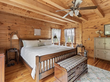 An image featuring property, window, furniture, comfort, cabinetry, wood, building, interior design, lighting, ceiling fan at 1761 Brick House Rd.