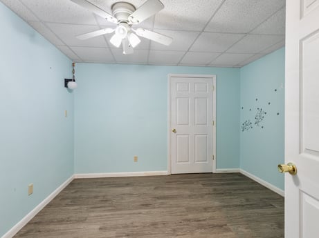 An image featuring fixture, door, wood, building, paint, interior design, ceiling fan, floor, flooring, wood stain at 1195 Twin Cuts Rd.