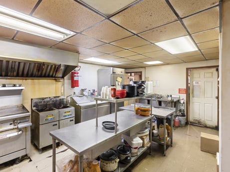 A kitchen at 199 State St featuring: table, fixture, floor, building, flooring, engineering, gas stove, kitchen, machine, room