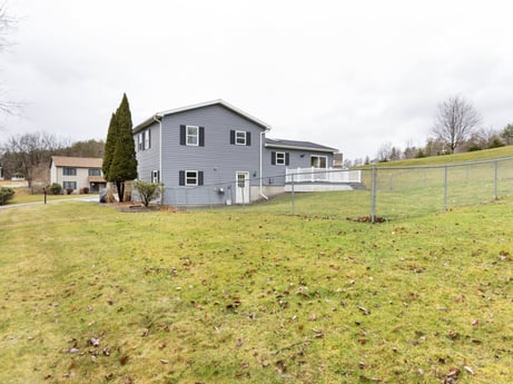 An image featuring sky, cloud, plant, building, house, tree, window, highland, land lot, natural landscape at 18 Country View Dr.