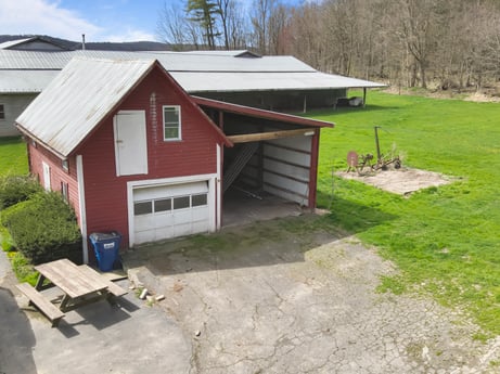 An image featuring plant, building, window, land lot, sky, grass, wood, landscape, residential area, tree at 525 Spring Hill Rd.