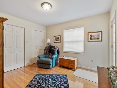 An image featuring property, couch, wood, interior design, comfort, picture frame, flooring, fixture, floor, door at 218 Point Rd.