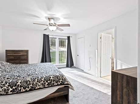 An image featuring cabinetry, furniture, property, ceiling fan, wood, comfort, door, interior design, building, bed frame at 1061 Muncy St.