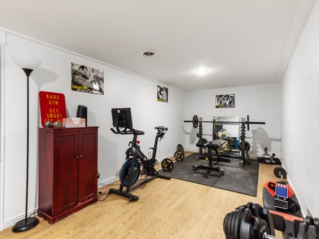 An image featuring property, picture frame, exercise machine, floor, interior design, building, flooring, stationary bicycle, exercise, hardwood at 17899 US-6.