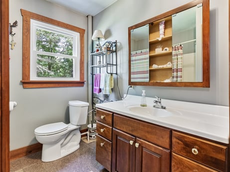 An image featuring mirror, bathroom cabinet, cabinetry, sink, plumbing fixture, property, furniture, tap, countertop, bathroom sink at 145 Nichols Ln.