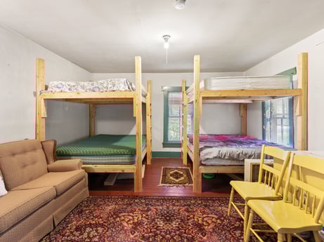 An image featuring furniture, property, comfort, wood, lighting, interior design, flooring, architecture, floor, real estate at 1039 Old Bernice Rd.