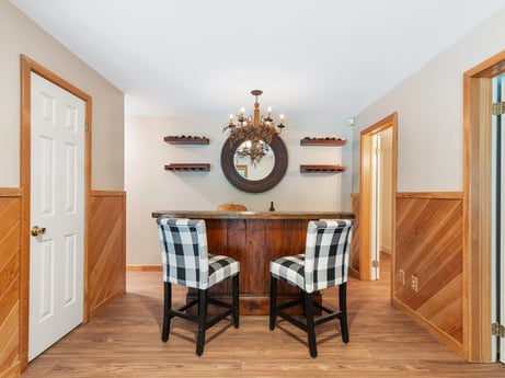 An image featuring picture frame, furniture, cabinetry, mirror, wood, architecture, orange, drawer, door, flooring at 276 Mountain View Ln.