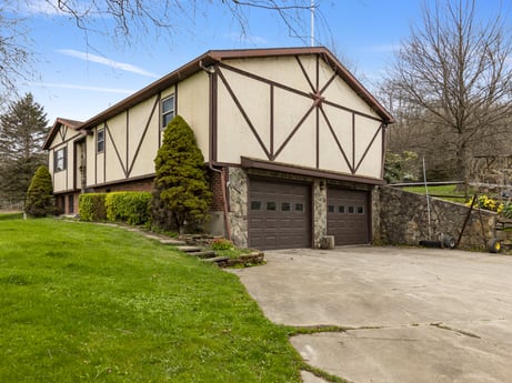 An image featuring sky, plant, property, building, cloud, tree, land lot, cottage, house, grass at 1569 S Macafee Rd.