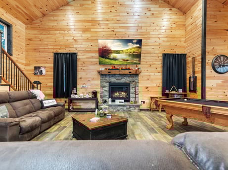 An image featuring furniture, table, couch, wood, living room, studio couch, interior design, building, flooring, floor at 17899 US-6.