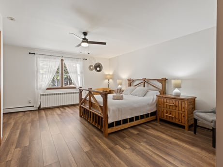 An image featuring furniture, building, comfort, wood, ceiling fan, cabinetry, interior design, grey, floor, flooring at 125 Rimstone Ct.