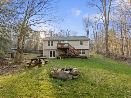 An image featuring sky, plant, building, property, window, cloud, tree, natural landscape, house, wood at 1061 Muncy St.