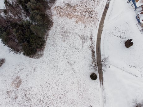 An image featuring automotive tire, snow, twig, road surface, freezing, plant, wood, asphalt, geological phenomenon, grass at Idle Wheels Ln.