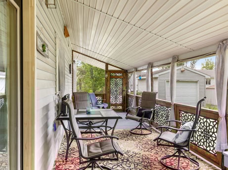 An image featuring property, chair, table, wood, shade, interior design, floor, flooring, porch, living room at 105 Thomas St.